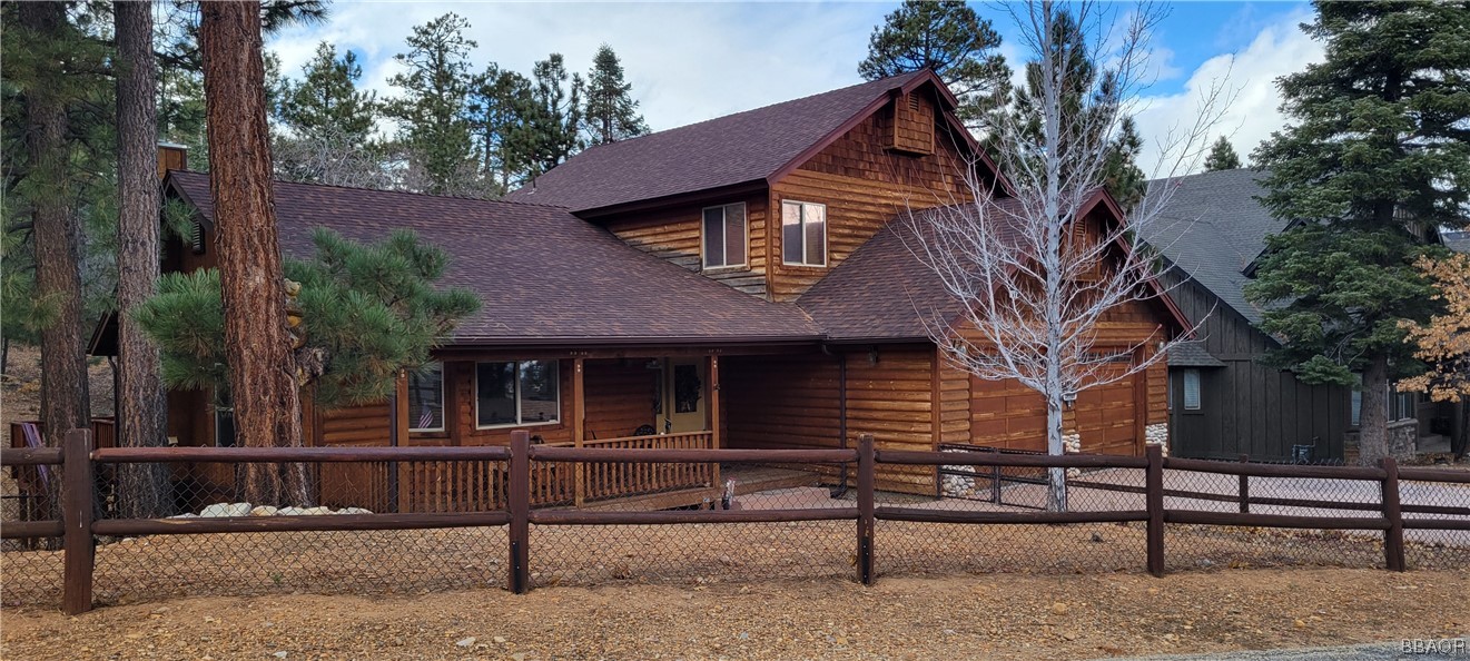 1685 Angels Camp Road Big Bear City, CA 92314 - Photo 2 of 35 a front view of a house with a fence