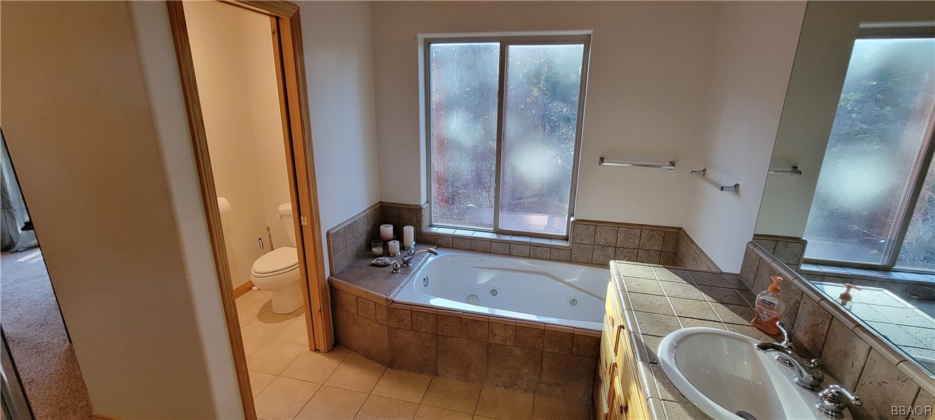 1685 Angels Camp Road Big Bear City, CA 92314 - Photo 21 of 35 a bathroom with a sink a bathtub and a mirror