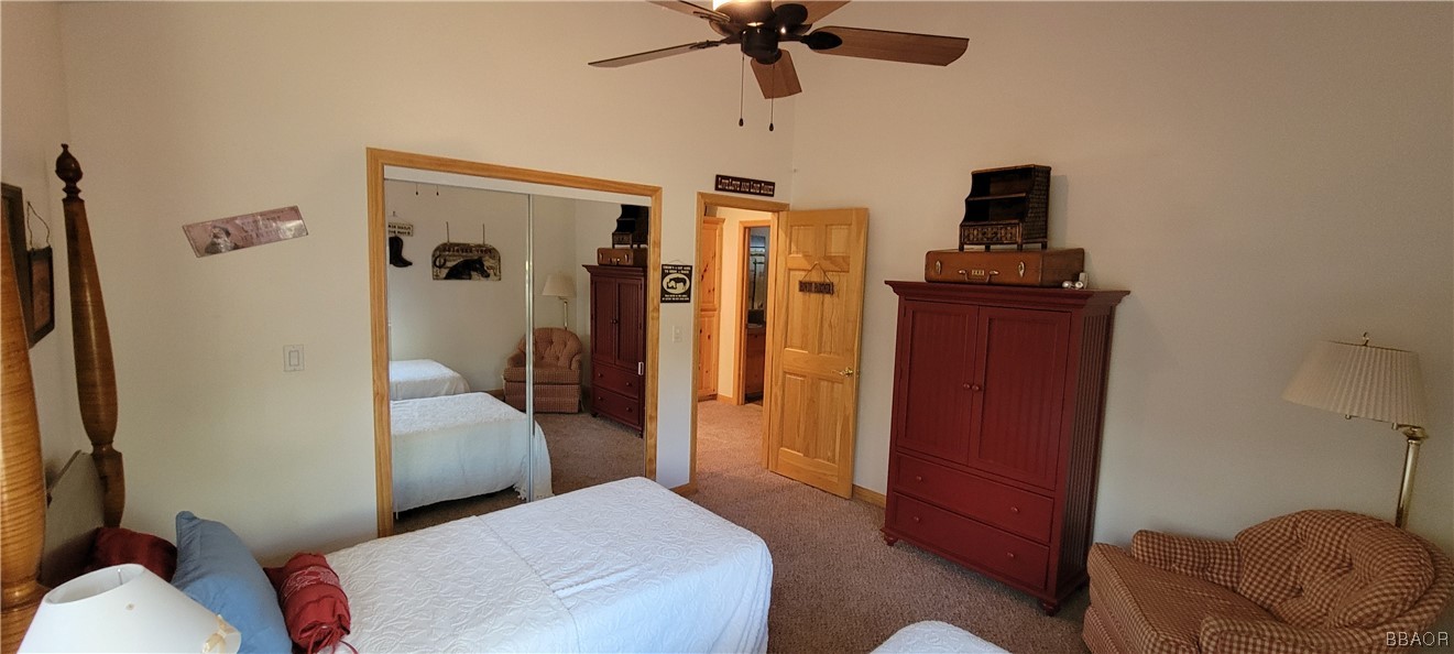 1685 Angels Camp Road Big Bear City, CA 92314 - Photo 23 of 35 a bedroom with a bed and a mirror