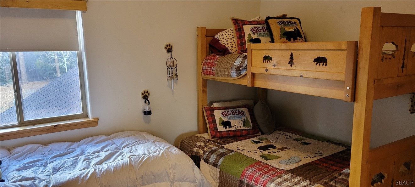 1685 Angels Camp Road Big Bear City, CA 92314 - Photo 27 of 35 a bedroom with a bed and hallway