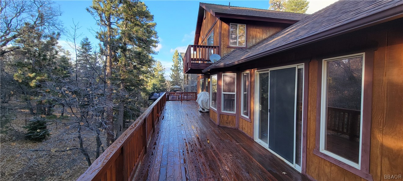 1685 Angels Camp Road Big Bear City, CA 92314 - Photo 29 of 35 a view of a balcony with wooden floor and stairs