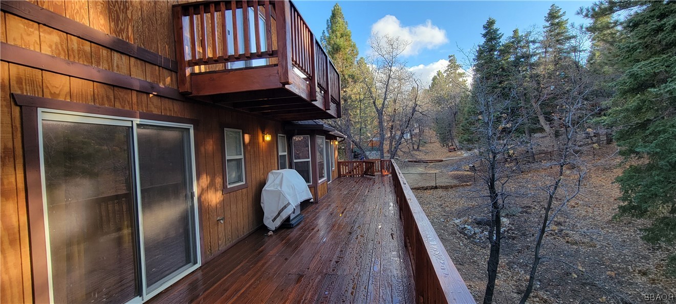 1685 Angels Camp Road Big Bear City, CA 92314 - Photo 30 of 35 a view of balcony with wooden floor and fence