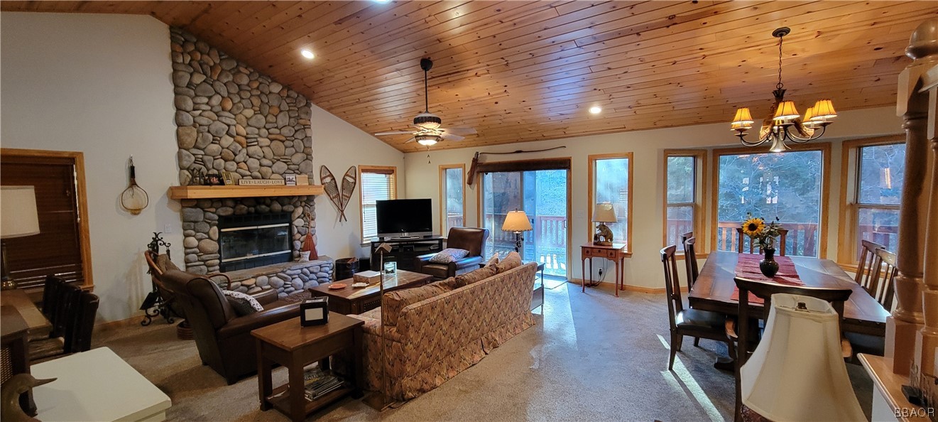 1685 Angels Camp Road Big Bear City, CA 92314 - Photo 3 of 35 a living room with furniture a flat screen tv and a fireplace
