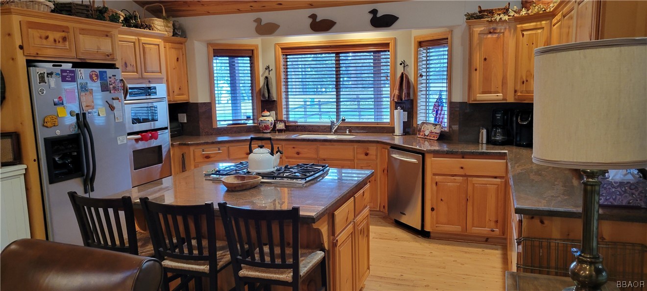 1685 Angels Camp Road Big Bear City, CA 92314 - Photo 7 of 35 a view of a dining room with furniture and window