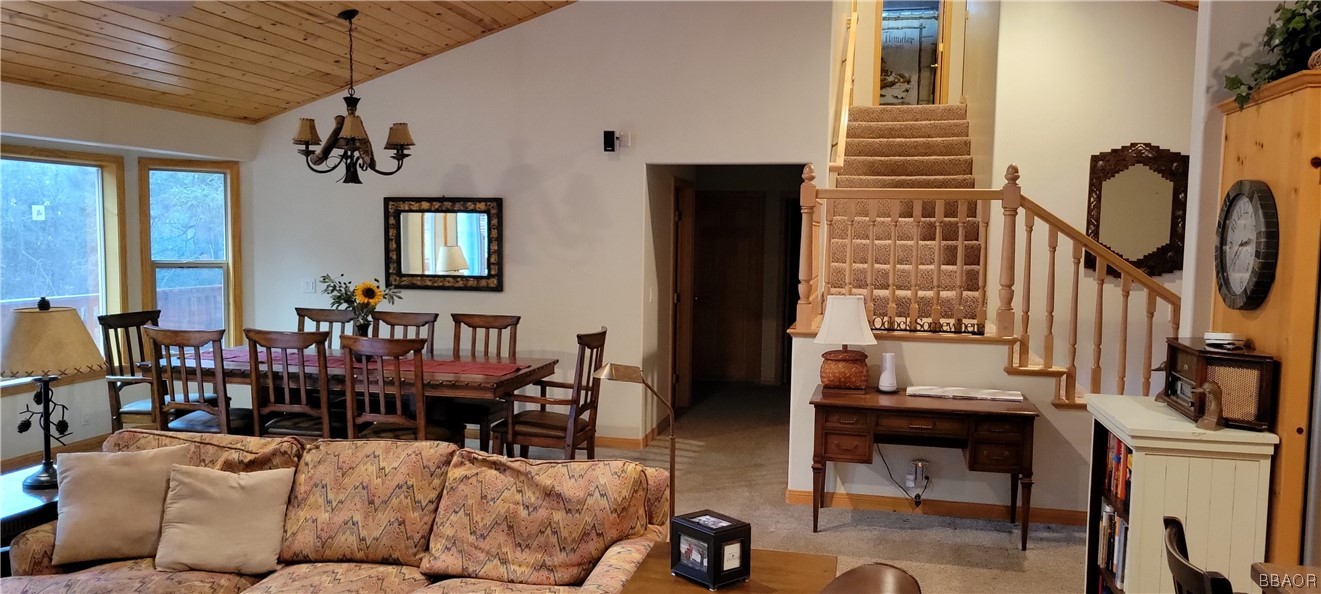1685 Angels Camp Road Big Bear City, CA 92314 - Photo 9 of 35 a living room with furniture a flat screen tv and windows