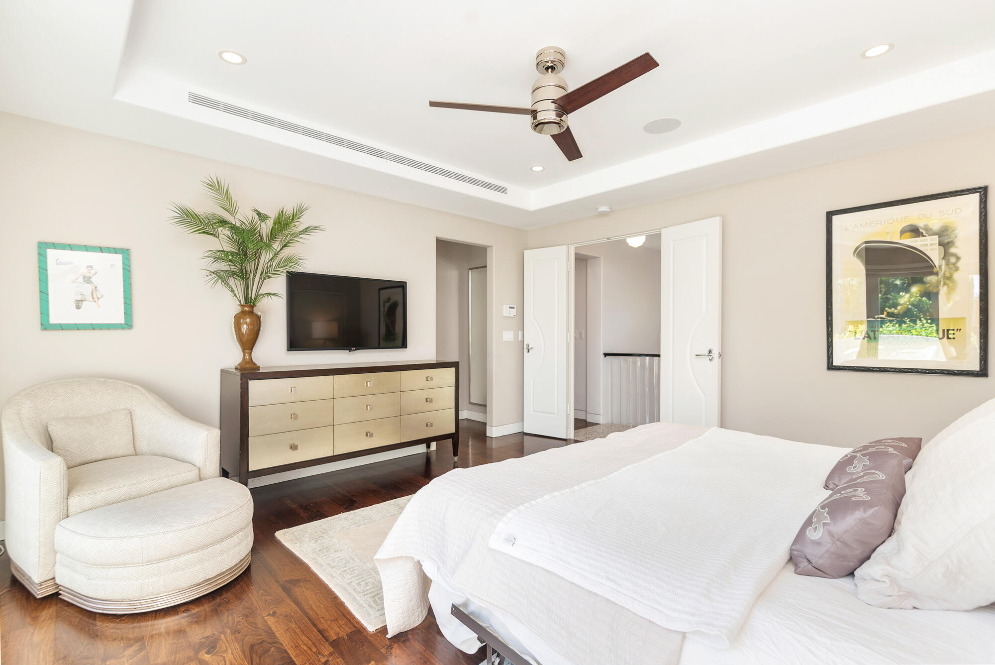 216 Colonial Lane Palm Beach, FL 33480 - Photo 22 of 48 a bedroom with a bed and a flat screen tv