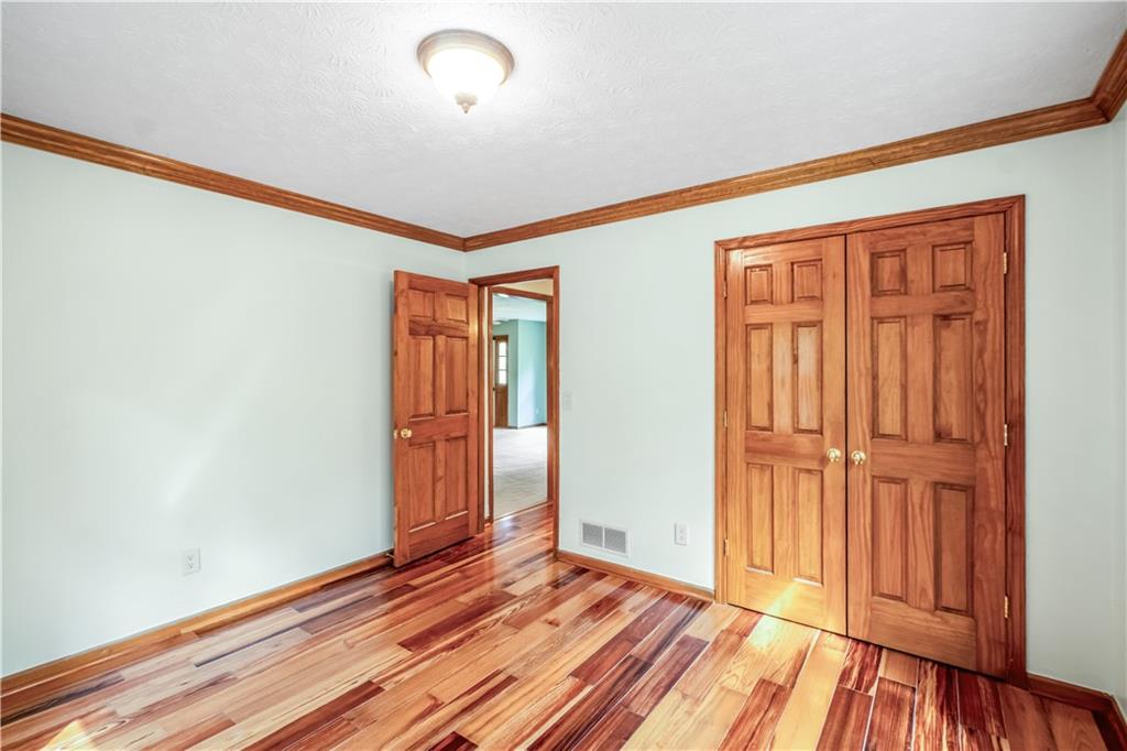 2177 Brooks Road Southeast Dacula, GA 30019 - Photo 24 of 42 a view of a room with wooden floor and entryway
