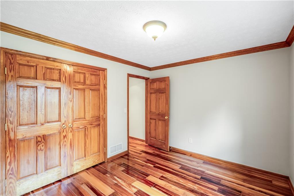 2177 Brooks Road Southeast Dacula, GA 30019 - Photo 25 of 42 a view of a livingroom with wooden floor and a window