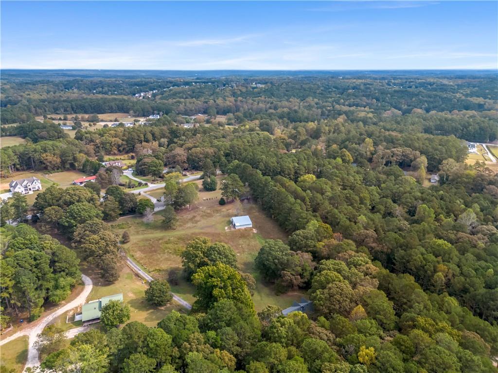 2177 Brooks Road Southeast Dacula, GA 30019 - Photo 34 of 42 an aerial view of a house with a yard