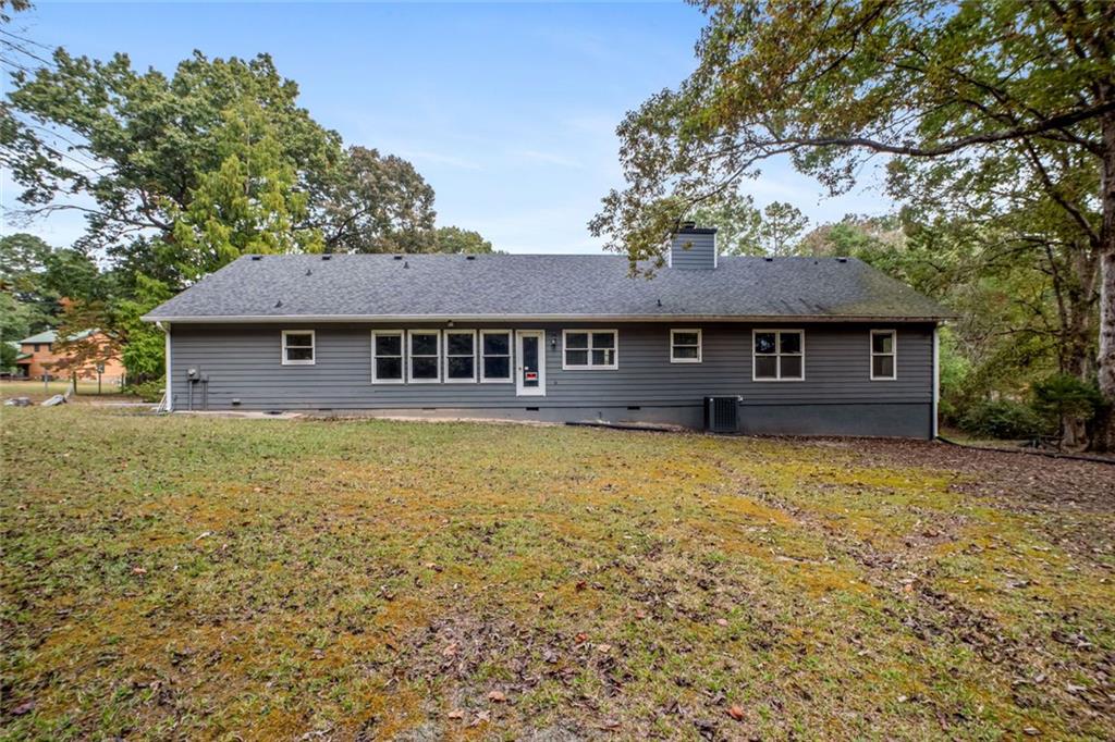 2177 Brooks Road Southeast Dacula, GA 30019 - Photo 4 of 42 a front view of a house with a garden