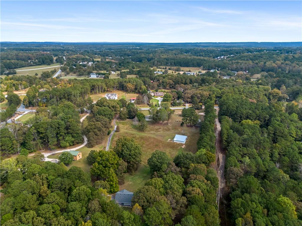 2177 Brooks Road Southeast Dacula, GA 30019 - Photo 42 of 42 an aerial view of residential houses with outdoor space and trees