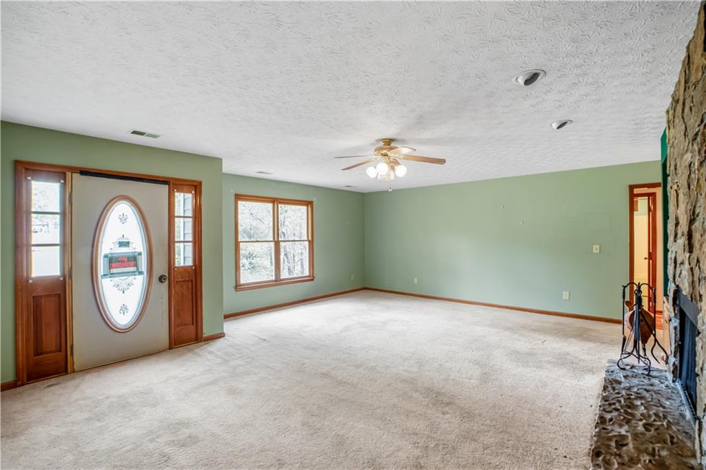 2177 Brooks Road Southeast Dacula, GA 30019 - Photo 6 of 42 an empty room with windows