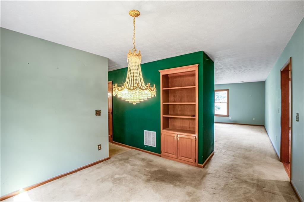 2177 Brooks Road Southeast Dacula, GA 30019 - Photo 7 of 42 a view of an empty room with a kitchen