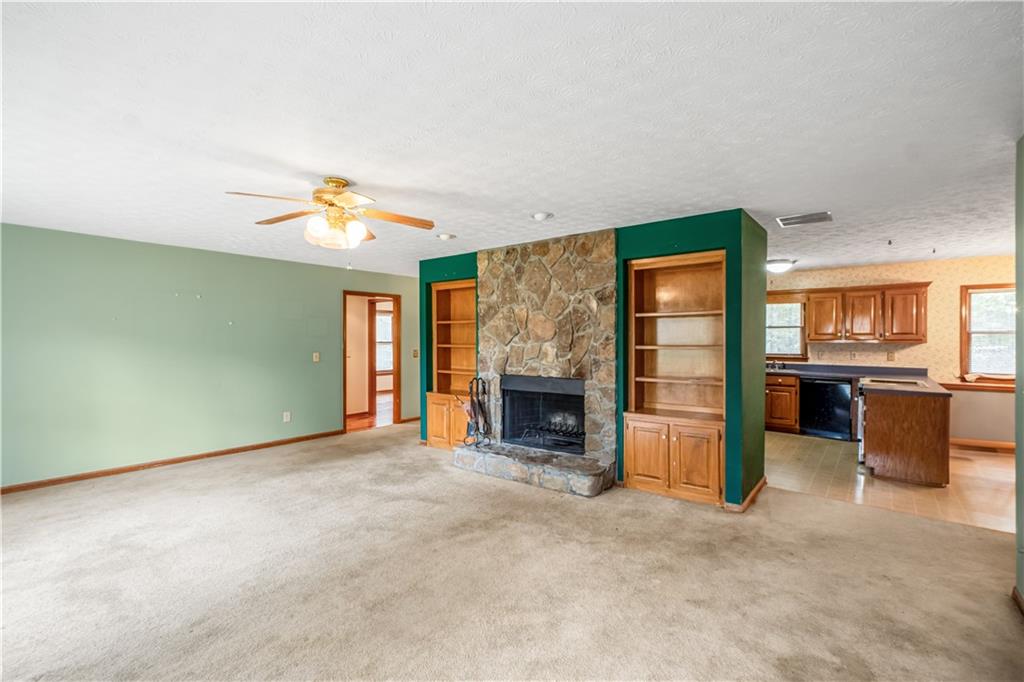 2177 Brooks Road Southeast Dacula, GA 30019 - Photo 9 of 42 a view of an empty room with a fireplace