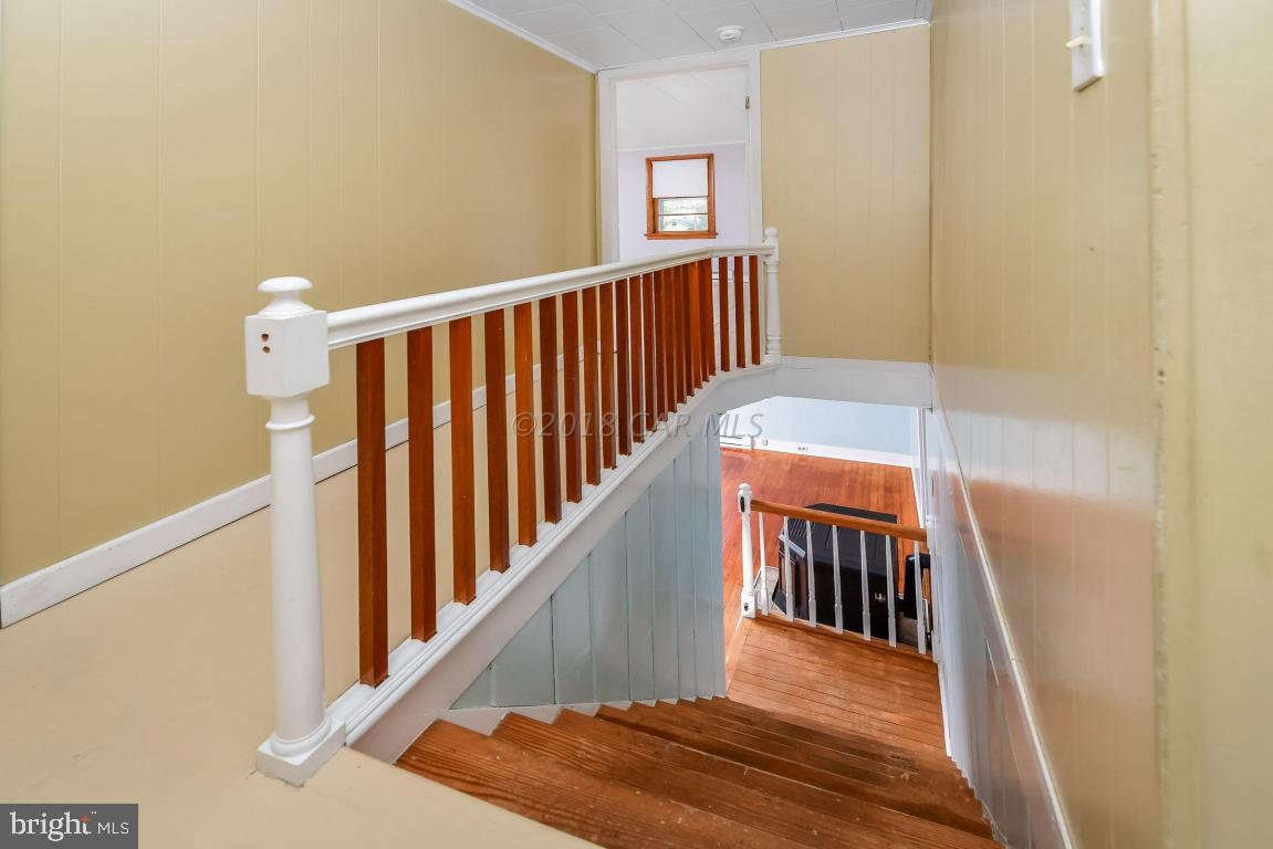 28253 Riverside Drive Salisbury, MD 21801 - Photo 14 of 22 a view of a hallway with windows and stairs