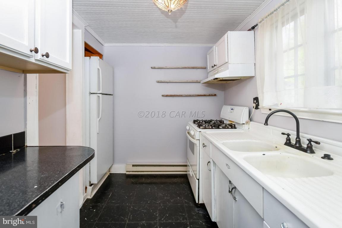 28253 Riverside Drive Salisbury, MD 21801 - Photo 7 of 22 a kitchen with stainless steel appliances granite countertop a sink stove and refrigerator