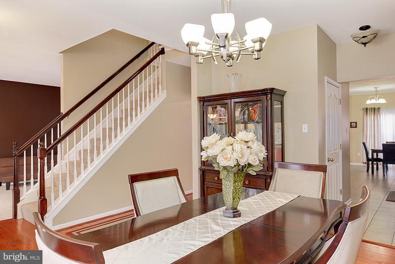 3036 Old Channel Road Laurel, MD 20724 - Photo 12 of 30 a view of a dining room with furniture and chandelier