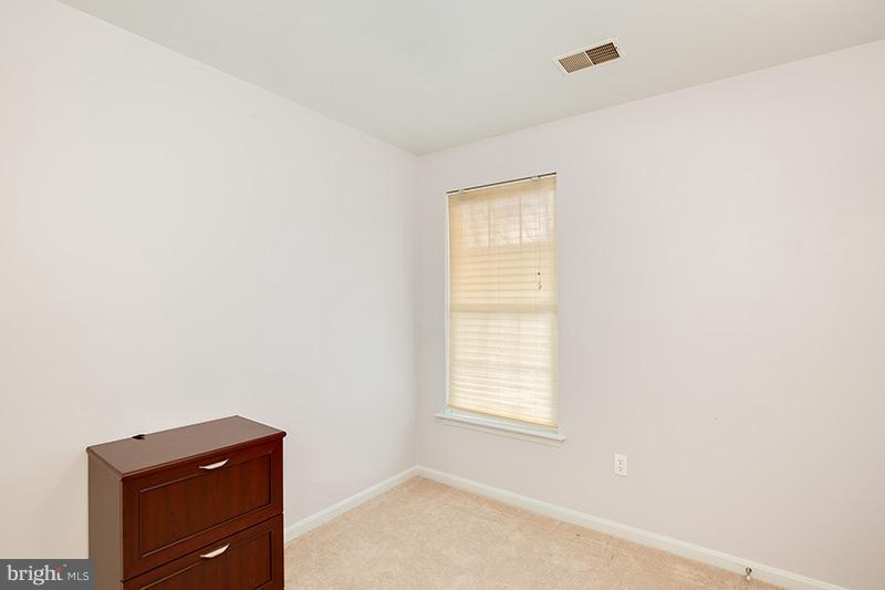3036 Old Channel Road Laurel, MD 20724 - Photo 19 of 30 a room with a window and dresser
