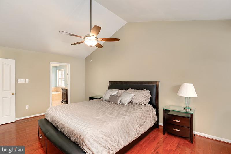 3036 Old Channel Road Laurel, MD 20724 - Photo 21 of 30 a bedroom with a bed and a lamp