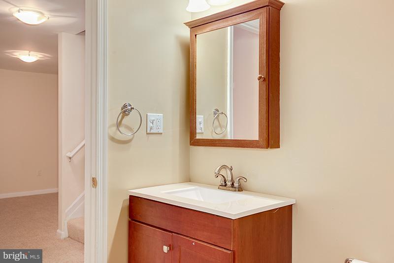 3036 Old Channel Road Laurel, MD 20724 - Photo 28 of 30 a bathroom with a sink and a mirror