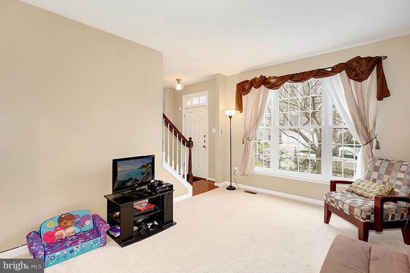 3036 Old Channel Road Laurel, MD 20724 - Photo 4 of 30 a bedroom with furniture and a flat screen tv