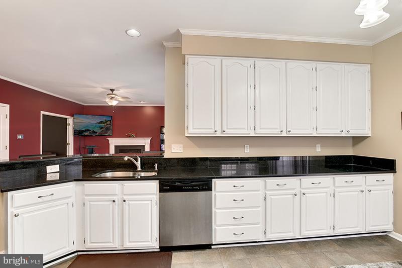 3036 Old Channel Road Laurel, MD 20724 - Photo 10 of 30 a kitchen with white cabinets and sink