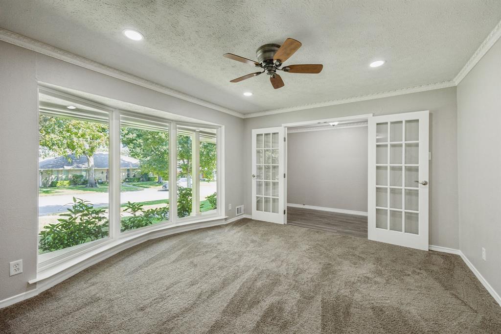 9536 Millridge Drive Dallas, TX 75243 - Photo 16 of 33 a view of an empty room with a window