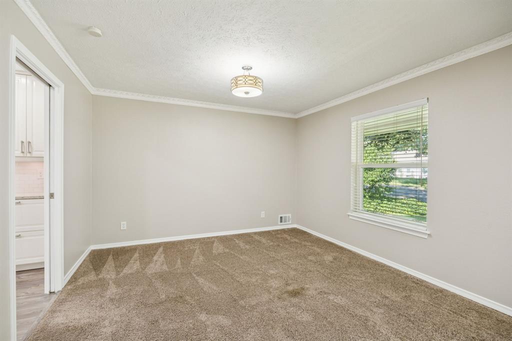 9536 Millridge Drive Dallas, TX 75243 - Photo 17 of 33 an empty room with a window