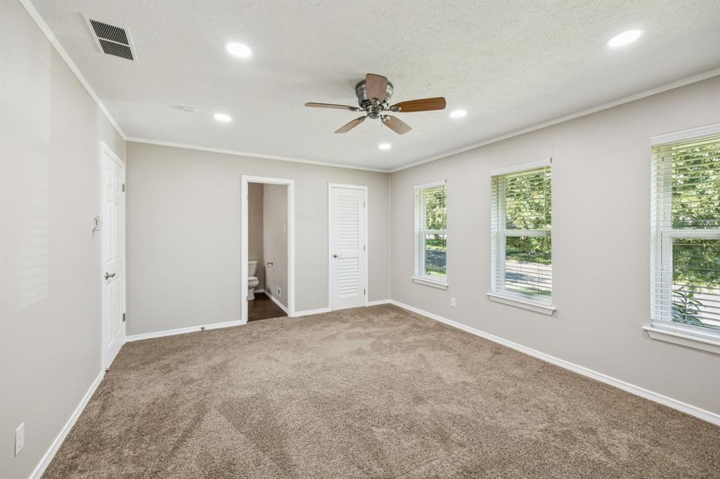 9536 Millridge Drive Dallas, TX 75243 - Photo 24 of 33 a view of a livingroom with a ceiling fan and window