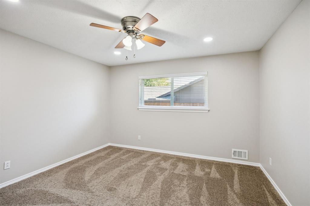 9536 Millridge Drive Dallas, TX 75243 - Photo 25 of 33 a view of an empty room with a window