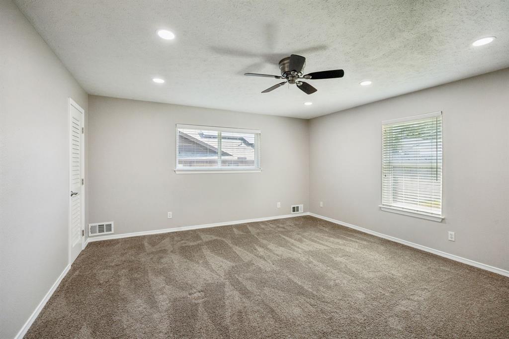 9536 Millridge Drive Dallas, TX 75243 - Photo 26 of 33 a view of an empty room with a window