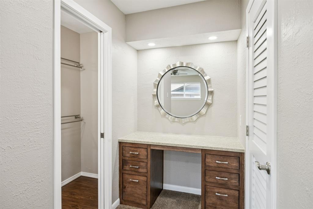 9536 Millridge Drive Dallas, TX 75243 - Photo 29 of 33 a bathroom with a sink and a mirror