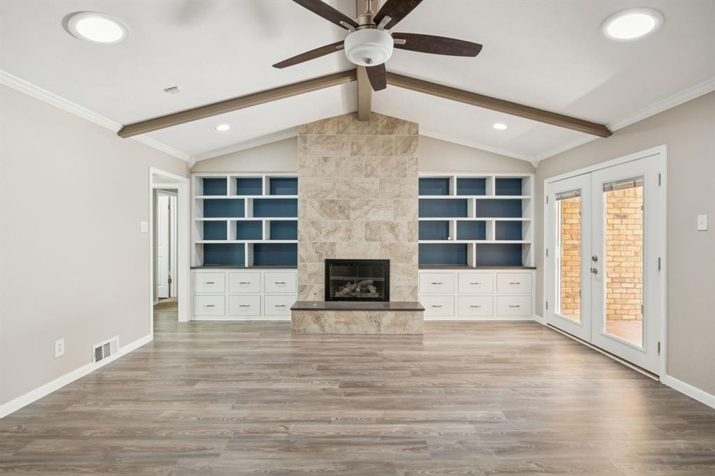 9536 Millridge Drive Dallas, TX 75243 - Photo 3 of 33 a view of a livingroom with a ceiling fan and window