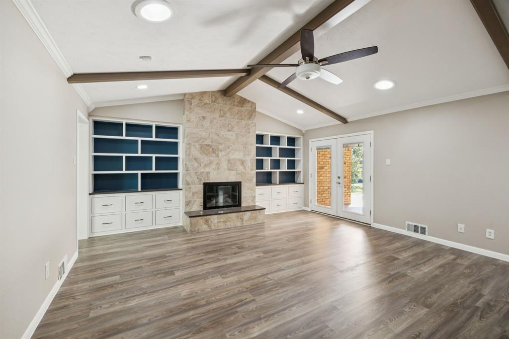 9536 Millridge Drive Dallas, TX 75243 - Photo 5 of 33 an empty room with windows and fireplace