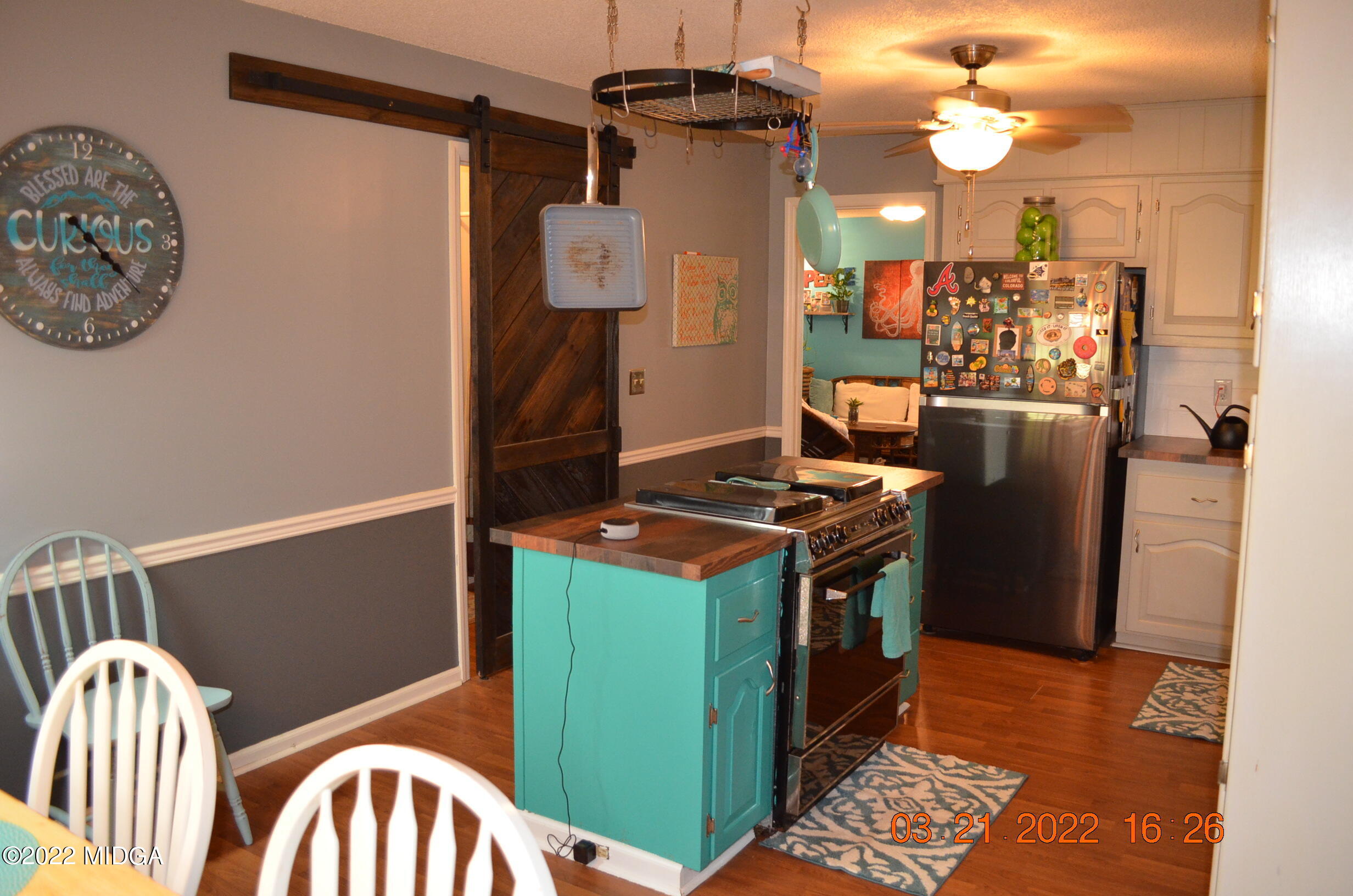 1167 Ridgeview Circle Macon, GA 31220 - Photo 19 of 26 a kitchen with stainless steel appliances granite countertop a stove a refrigerator and a table with wooden floor