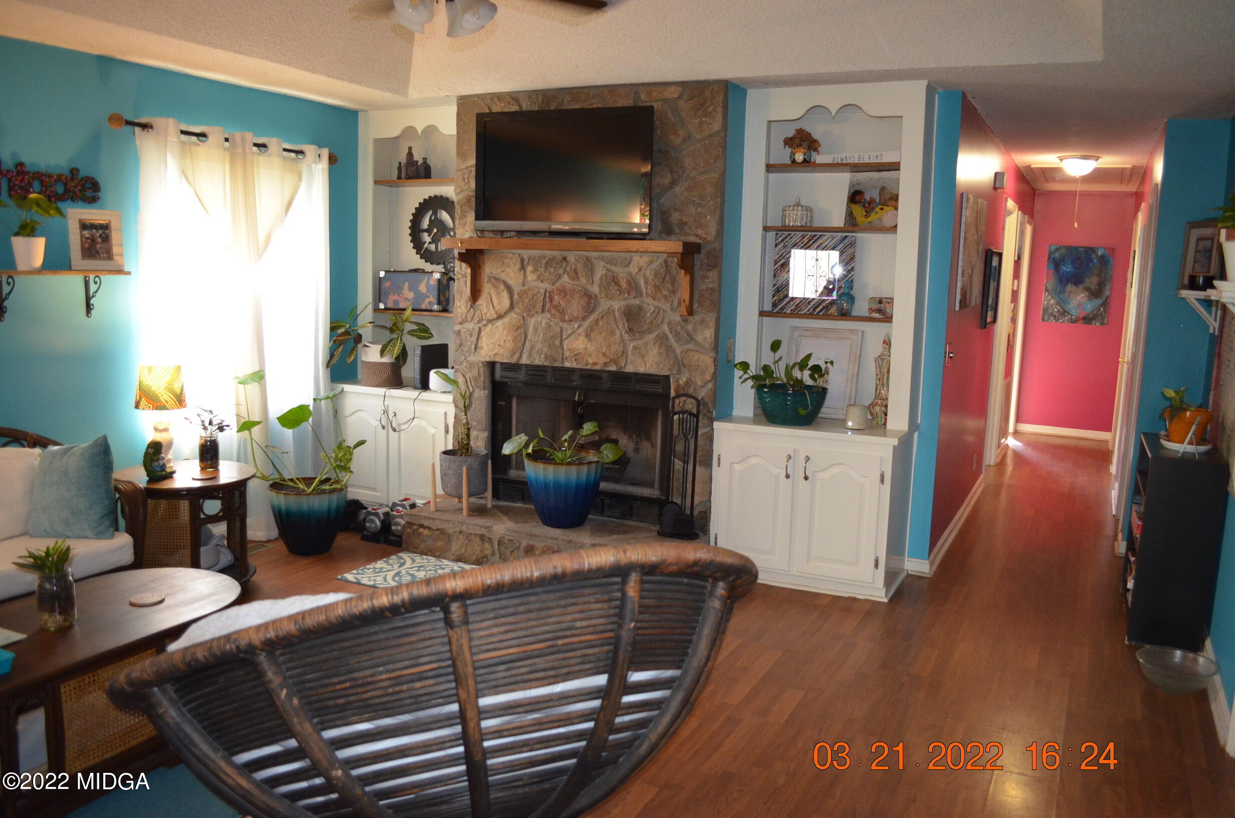1167 Ridgeview Circle Macon, GA 31220 - Photo 3 of 26 a living room with furniture a flat screen tv and a fireplace
