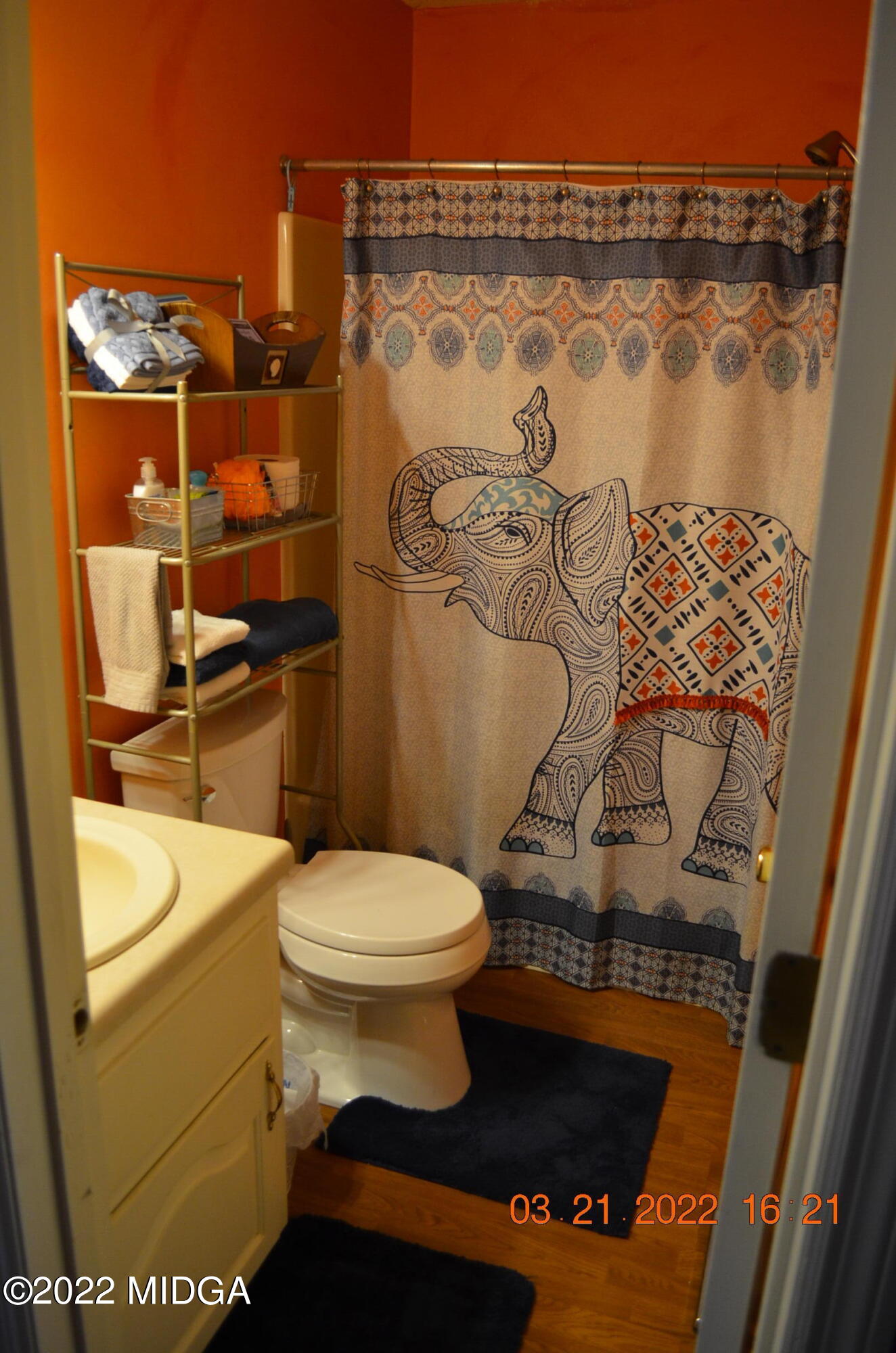 1167 Ridgeview Circle Macon, GA 31220 - Photo 9 of 26 a bathroom with a toilet and a shower curtain
