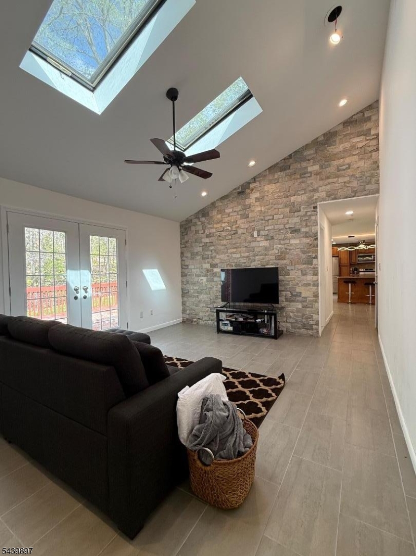22 Karen Road Vernon, NJ 07422 - Photo 25 of 26 a living room with furniture a fireplace and a flat screen tv