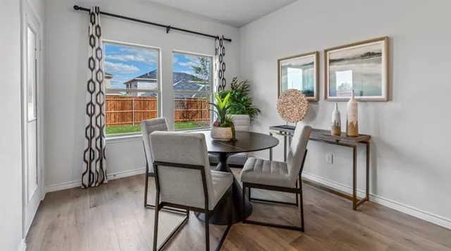 a kitchen with kitchen island a sink stove and refrigerator