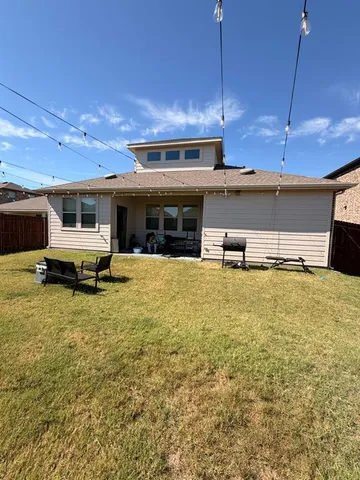 a view of a kitchen with a sink and cabinets