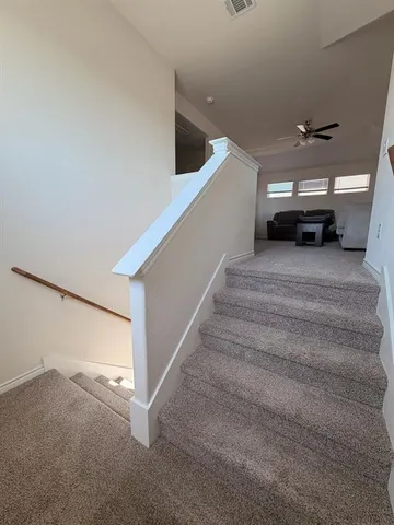 a bed room with a bed and a night stand