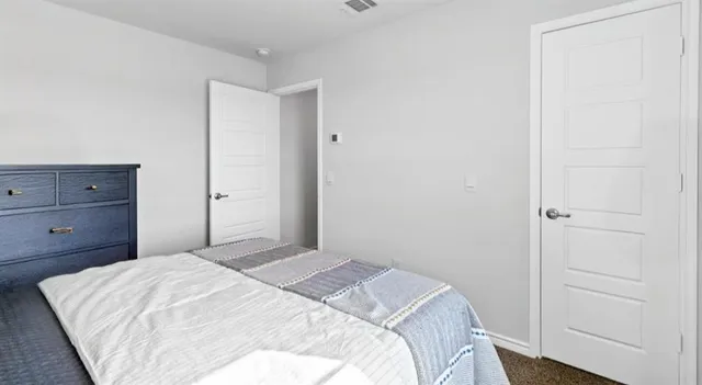 a bathroom with a tub shower and a sink