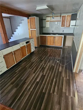 a view of kitchen appliances with cabinets