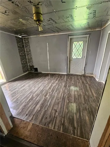 a view of an empty room with windows