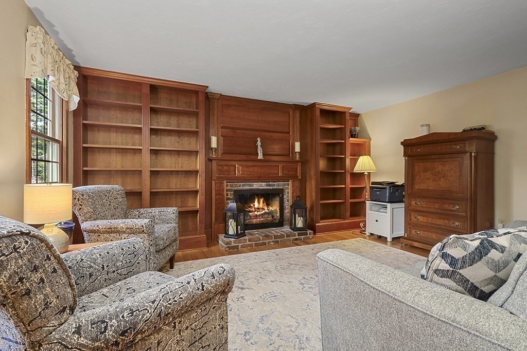 6 Lydia Lane Franklin, MA 02038 - Photo 11 of 42 a living room with furniture and a fireplace