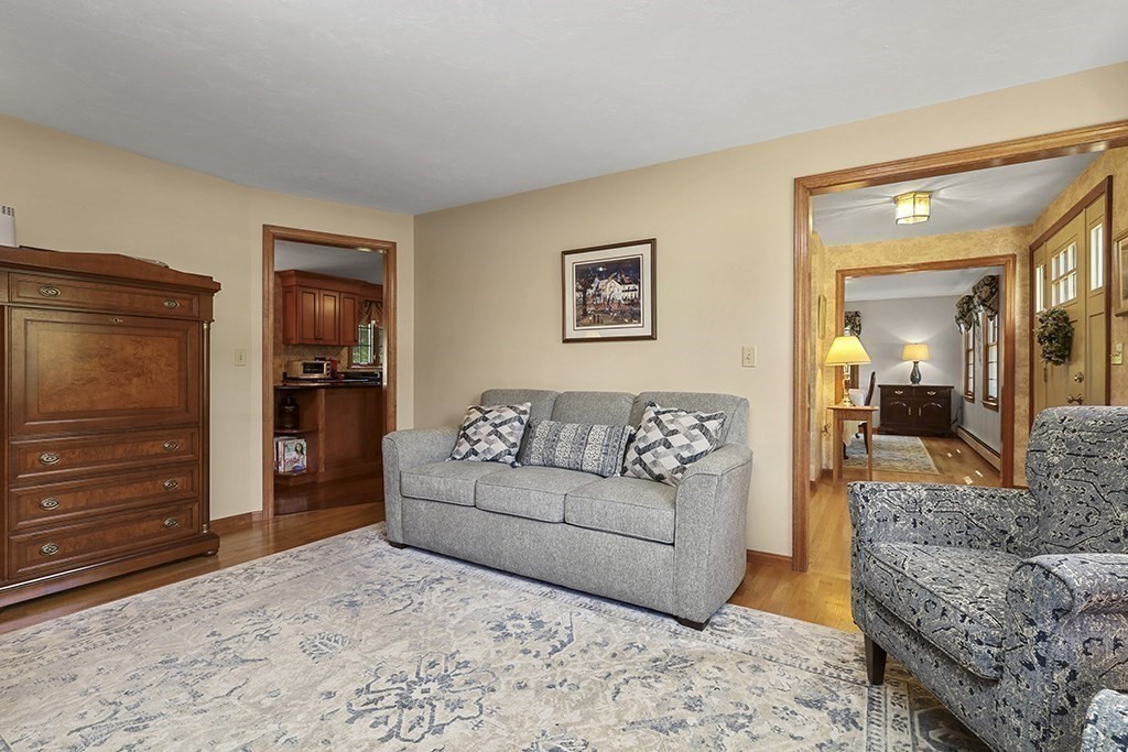 6 Lydia Lane Franklin, MA 02038 - Photo 14 of 42 a living room with furniture and a dresser