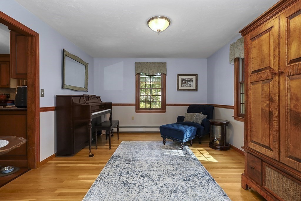 6 Lydia Lane Franklin, MA 02038 - Photo 19 of 42 a living room with furniture fireplace and a window
