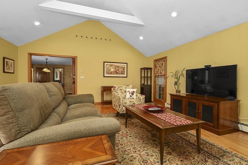 6 Lydia Lane Franklin, MA 02038 - Photo 25 of 42 a living room with furniture and a flat screen tv