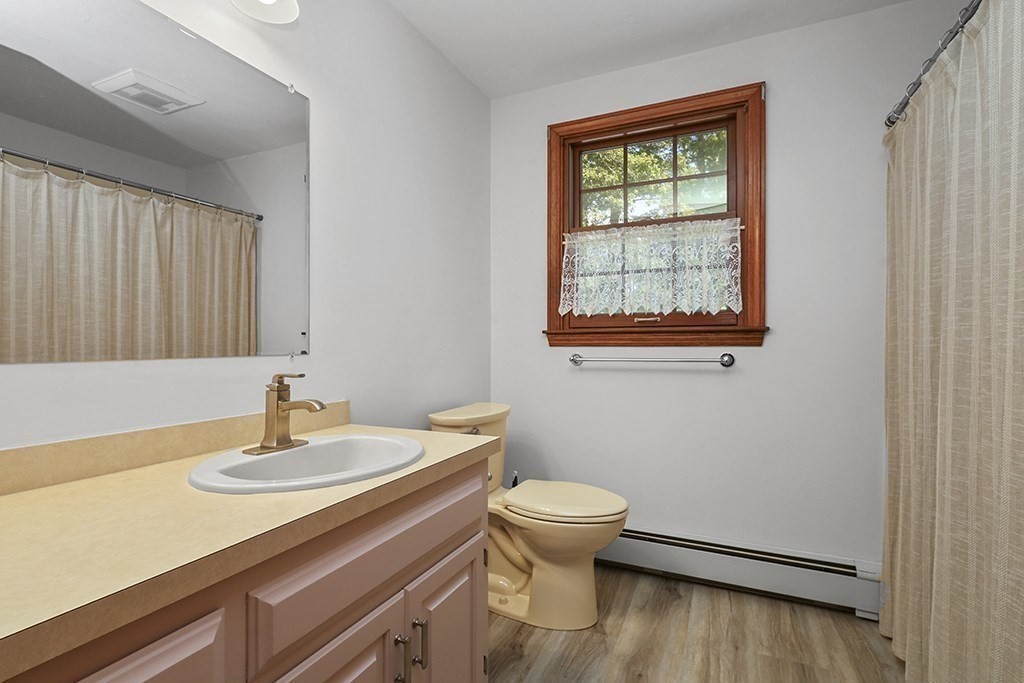 6 Lydia Lane Franklin, MA 02038 - Photo 31 of 42 a bathroom with a sink a toilet and a window