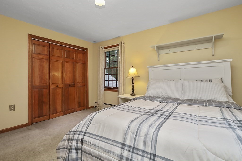 6 Lydia Lane Franklin, MA 02038 - Photo 36 of 42 a bedroom with a bed and wooden floor